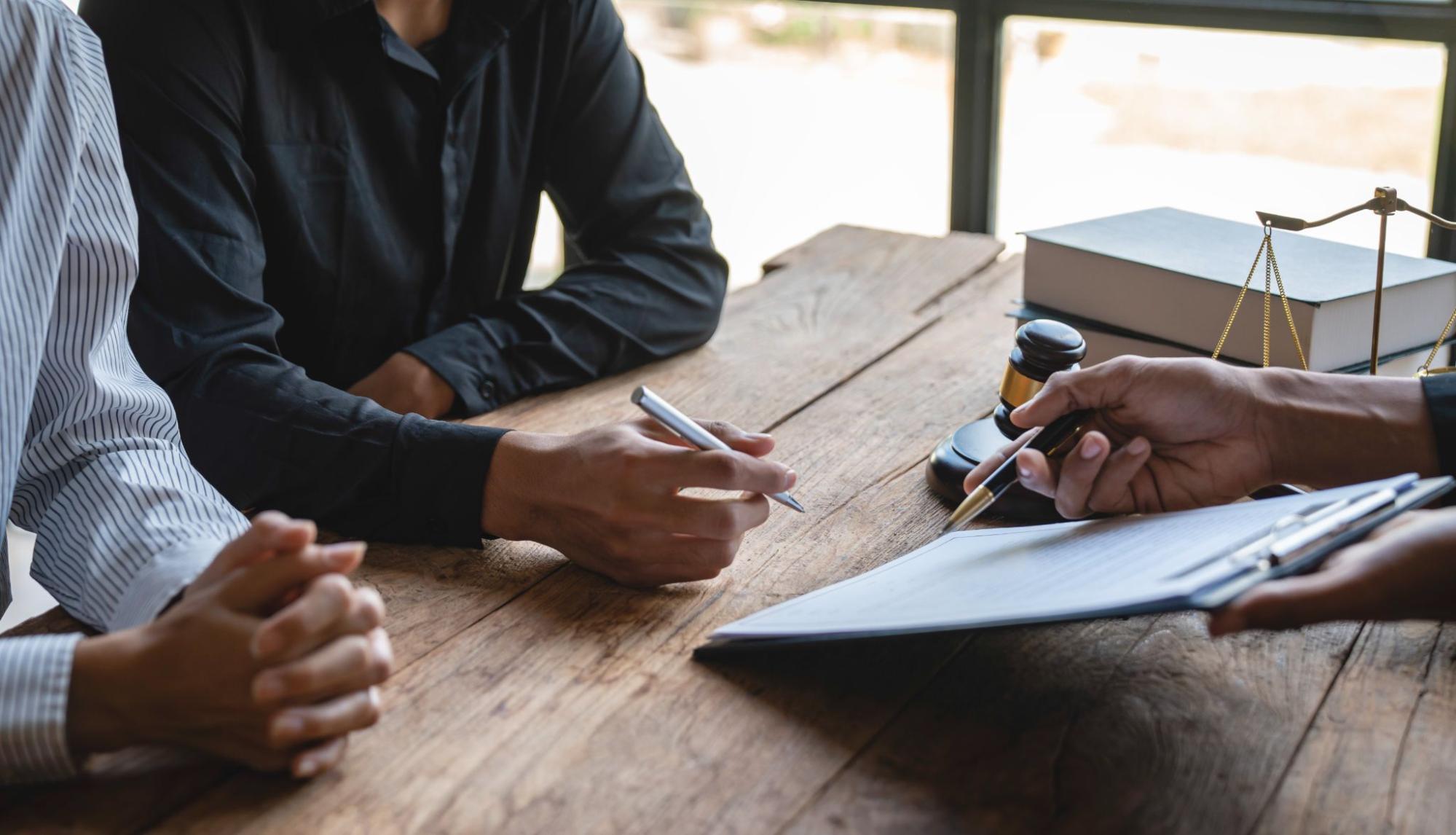 Cropped shot of an insurance contractor explaining business liability coverage details during a client consultation