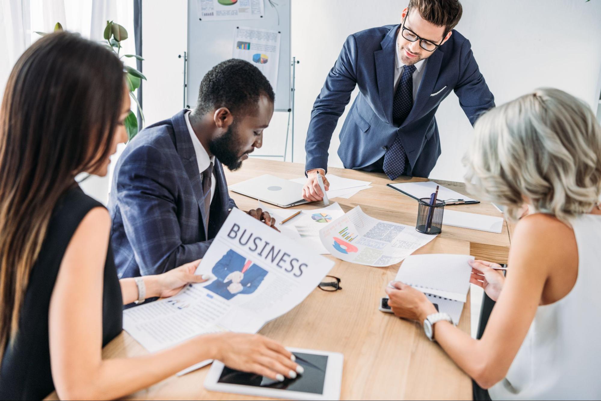 usinesspeople review their quarterly reports to determine what insurance policies they need for the coming year.