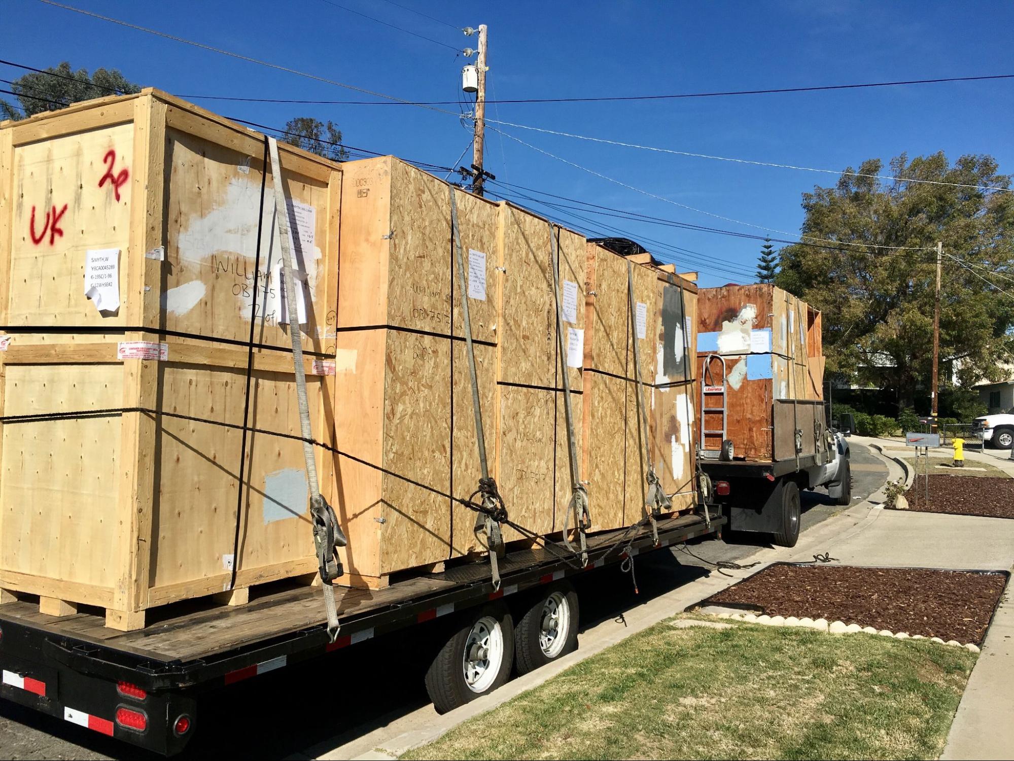 Large crates being transported on a flatbed trailer