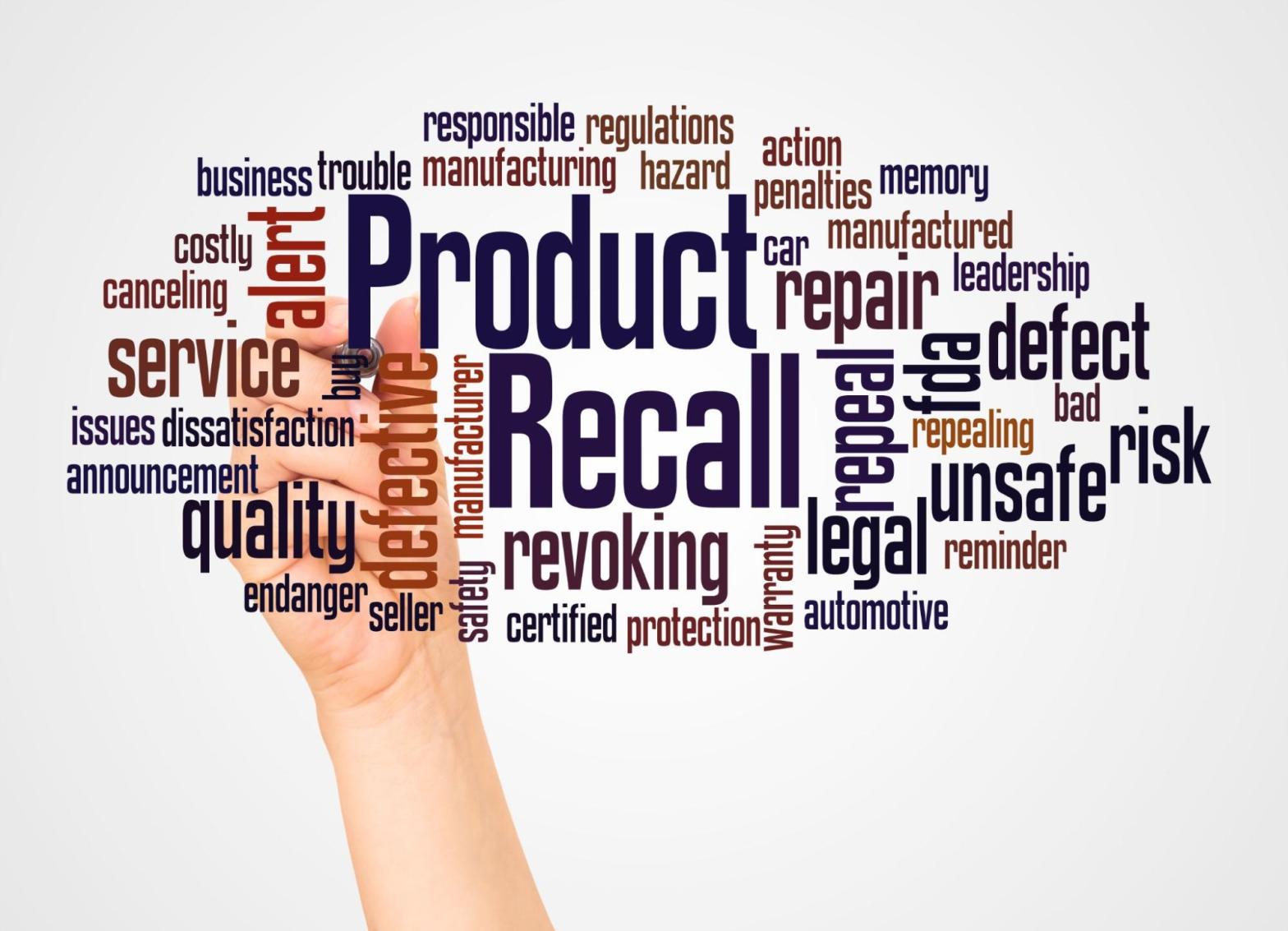 Hand reaching toward a product recall word cloud representing business risk and recall coverage