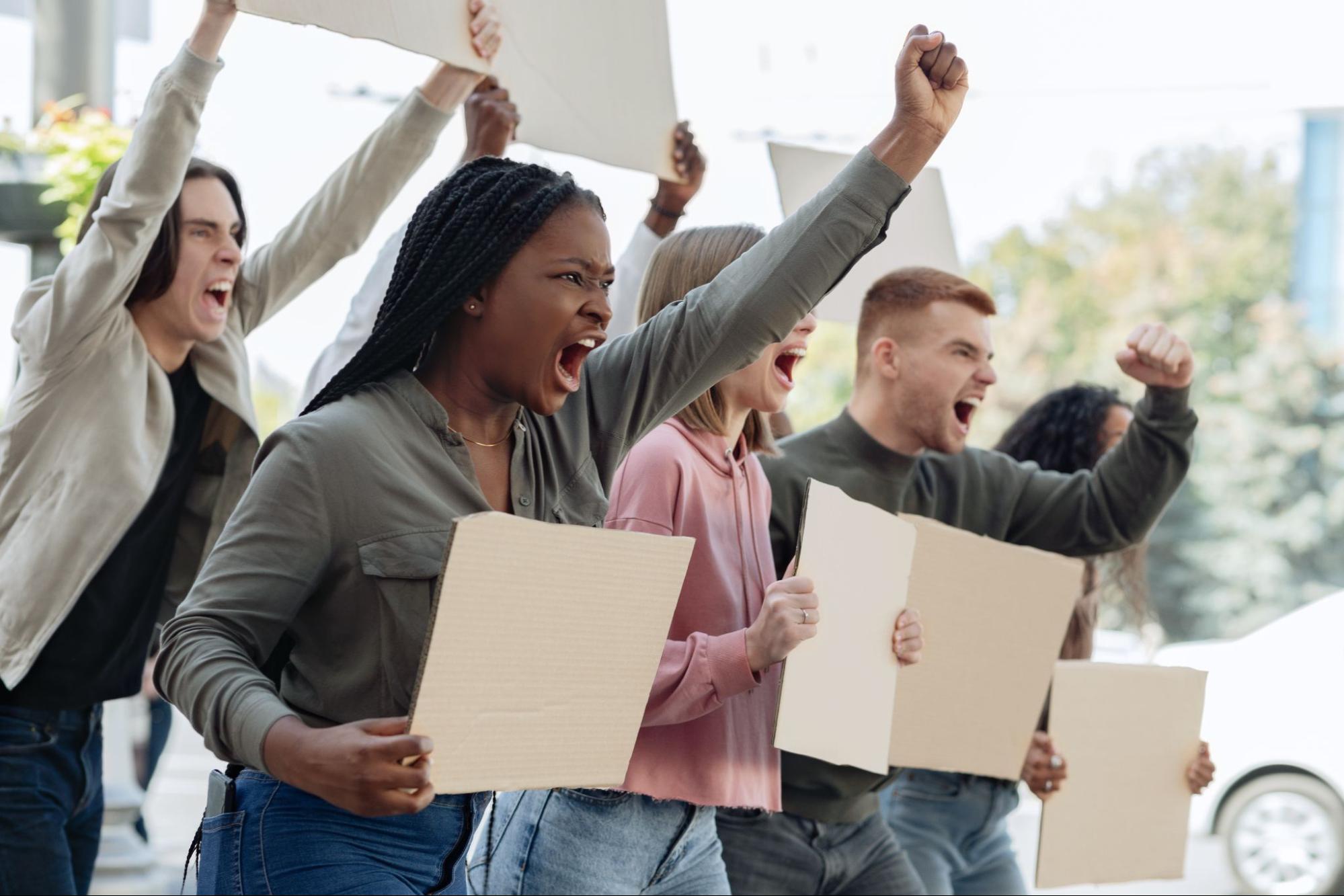 People protesting discriminatory hiring practices that can lead to management liability claims