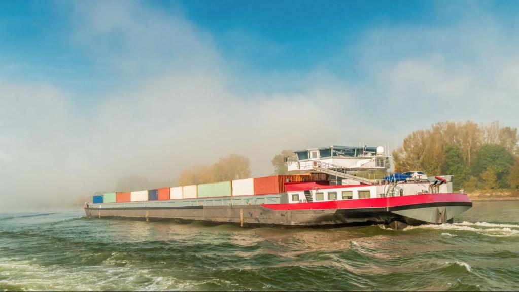 Inland cargo transport carrying containers covered by marine insurance.